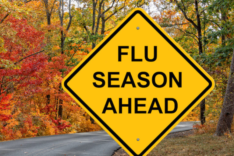 Flu Season Ahead Caution Sign - Autumn Background