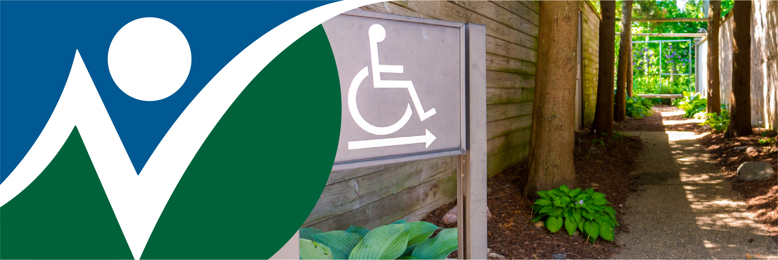 NNCIL logo next to a photo of a path with a wheelchair accessibility symbol